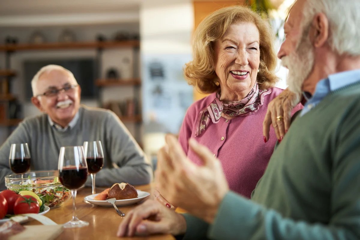 the benefits of socializing in assisted living enjoying a healthy meal with a conversation